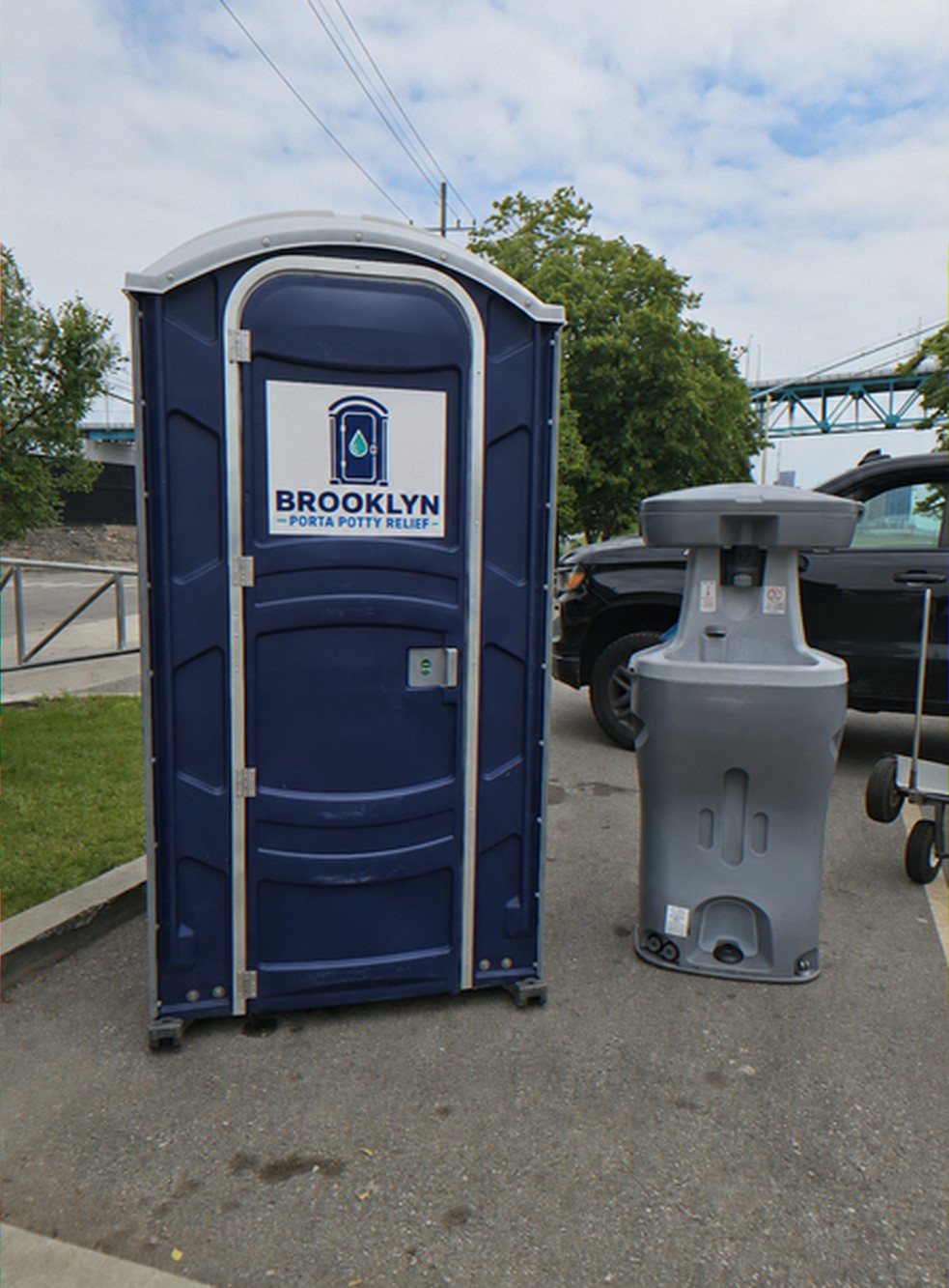Standard portable toilet and hand wash station on a work site